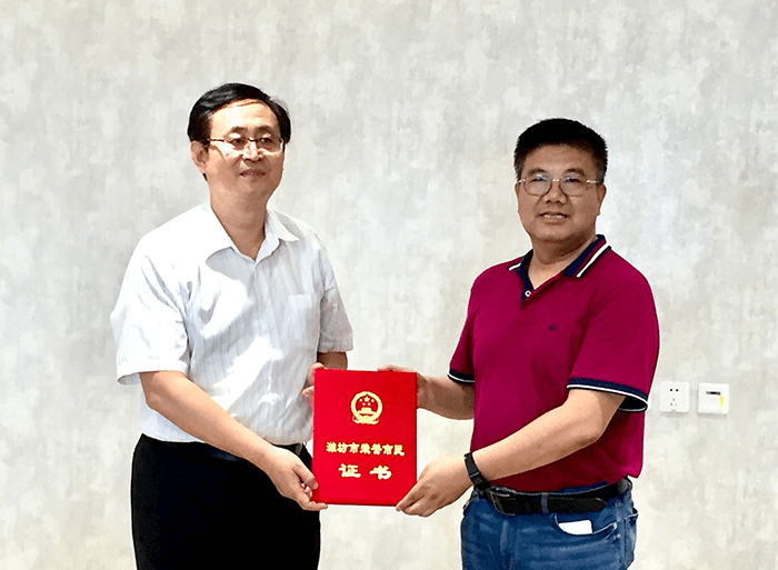 Nedham was awarded “Honorary Citizen of Weifang”